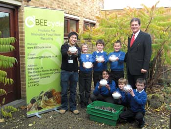 Kenneth Cheung with headteacher Len Guest (right) and pupils at Moorside Primary School