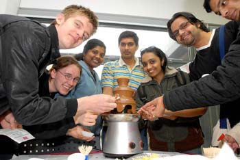Students enjoying the chocolate fountain at the opening of CEEC