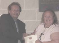 Candys Hunter receives her PASSPORT award from Prof Derek Seward