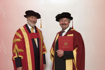 Dr Mike Dexter receiving his honorary degree from Sir Christian Bonington