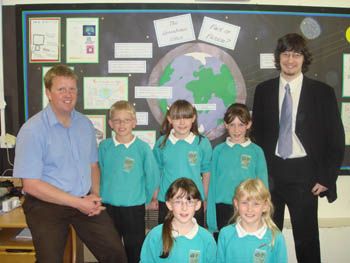 Ghyllside School Class Teacher Matt Towe (left) with Lancaster University student Alex Bartlett (far right) and year four pupils at Ghyllside School