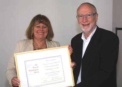 Professor Pam Maras presenting Professor Cary Cooper with his award