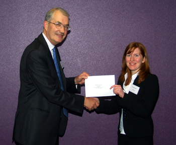 Photo caption: Julia Krier is presented with her award by Peter Hannam, President of Yorkshire Law Society