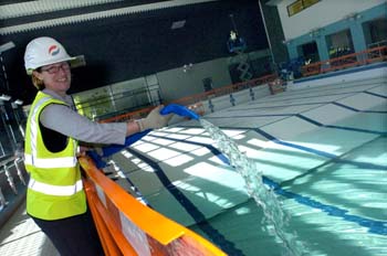 Director of Sport Kim Montgomery filling the new pool: photo courtesy of Nigel Slater