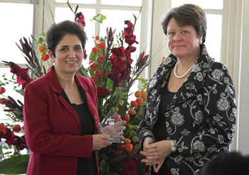 Professor Farideh Honary receiving Lancaster's bronze award from Julie Ashdown