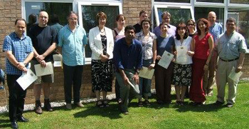 Teachers with their certificates