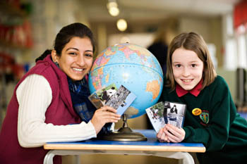 GDGWI student with a pupil from Lancaster Road Primary School