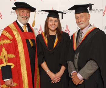 Chancellor Sir Chris Bonington congratulates Sarah Evans and Peter Standing