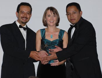 Tsiry Wilkinson (left) and Dina Rajaona (right) receive the Start Up Business of the Year Award from Gillian Bardin