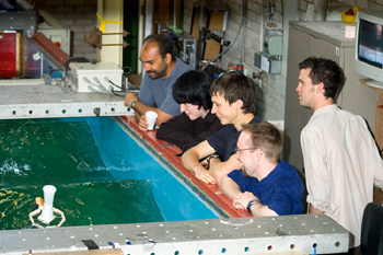 School children In the Engineering Department, pupils were given the task of designing and testing a floating device which would support a glass of water in a wave tank